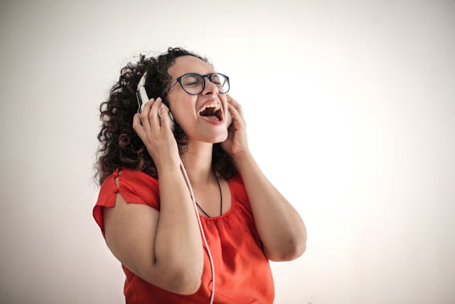 Woman singing with headphones on